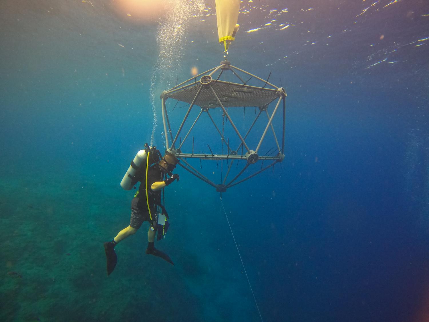 Nortek instrument under water with a diver