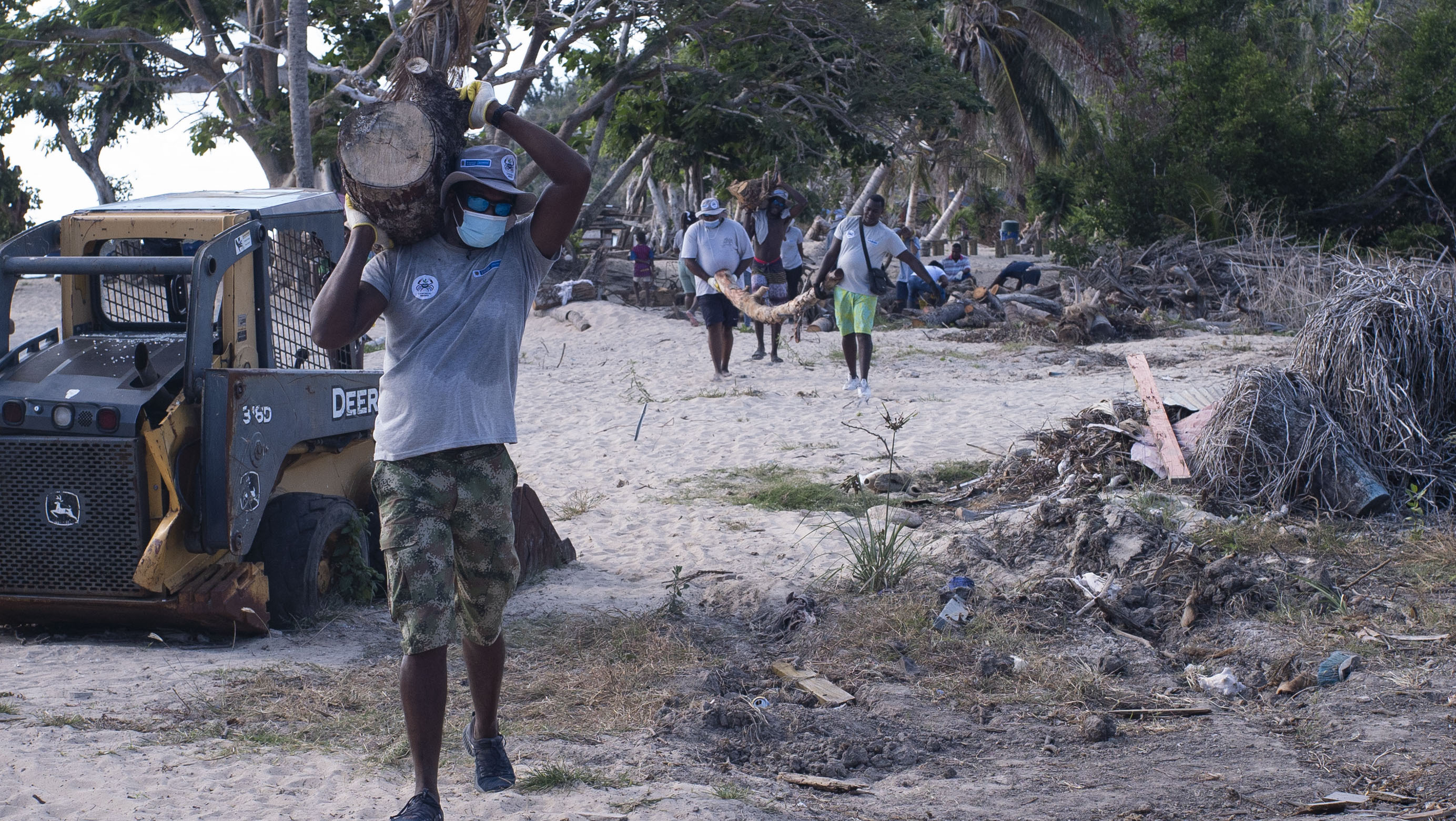 Clearing up debris after the damage caused by a hurricane affecting Colombia’s coastal communities.