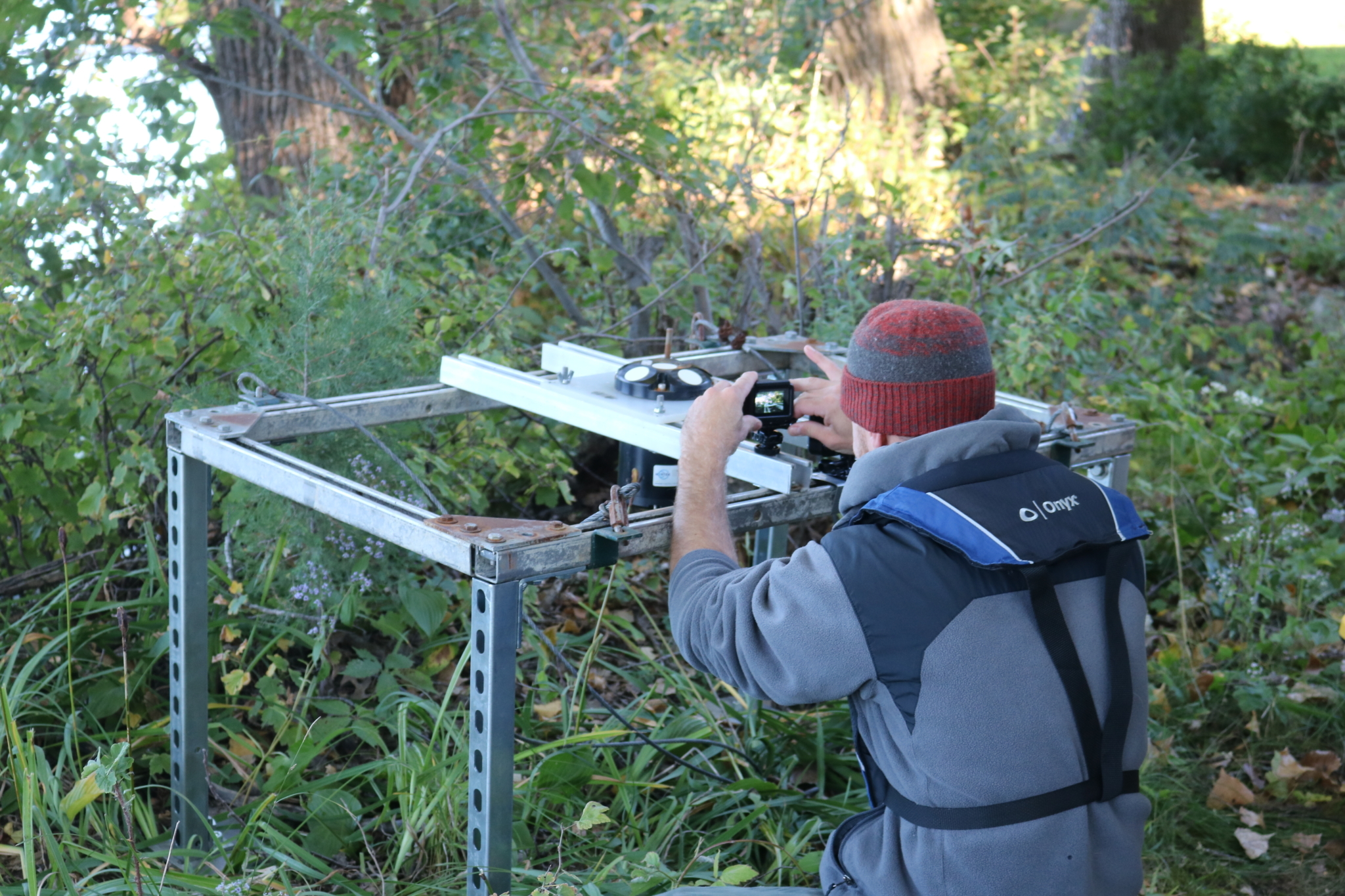 UMN Signature ADCP Study research setting up sensor on shore