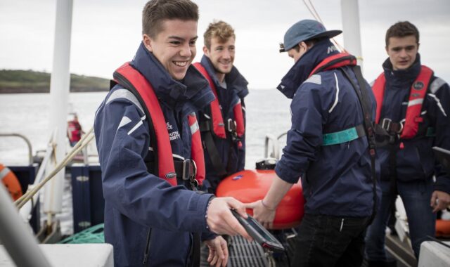Plymouth University students aboard the university’s research vessel Falcon Spirit, deploying a Nortek Signature1000 mounted in a subsurface buoy.